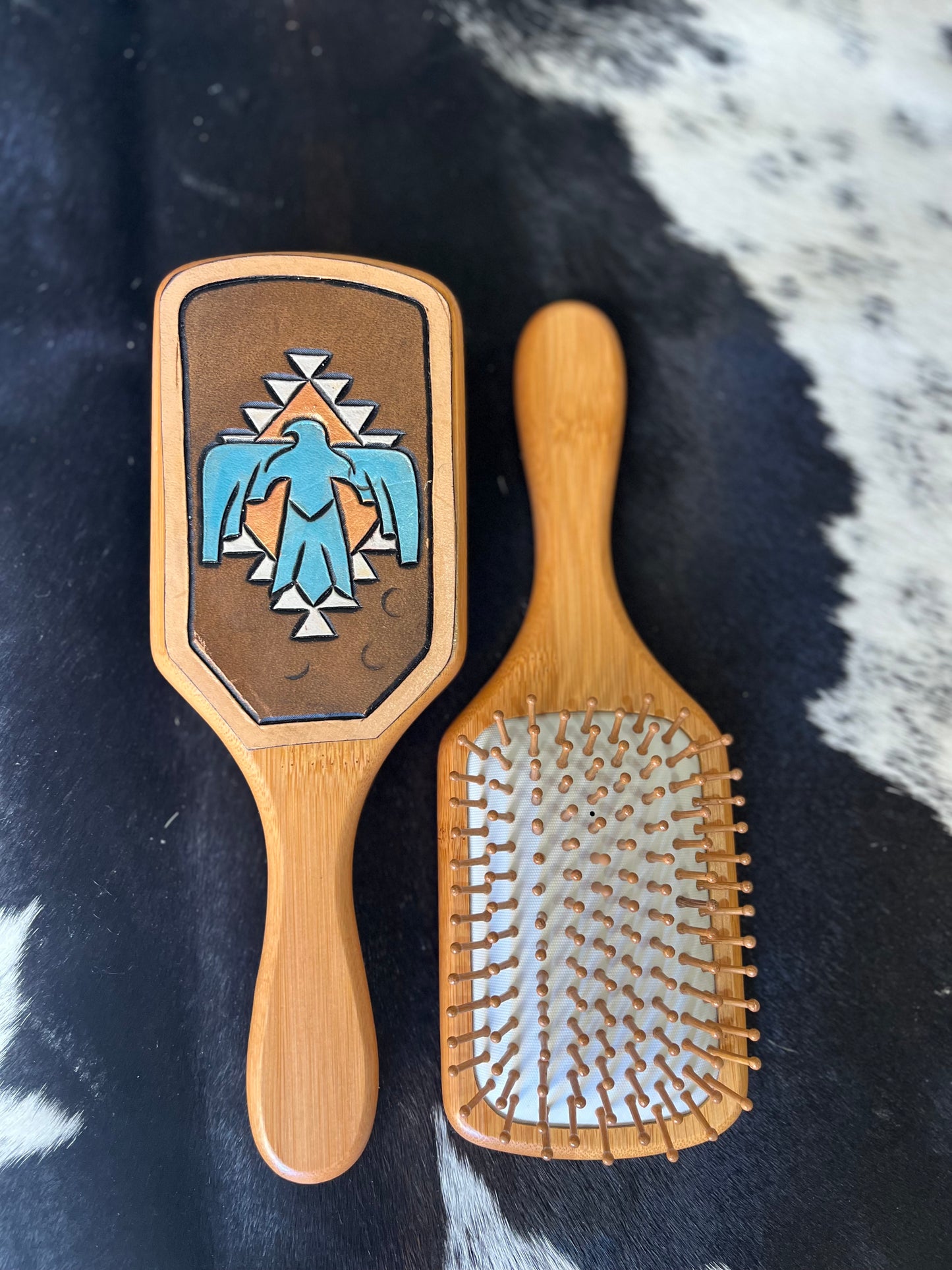 Hand tooled and cowhide hairbrush