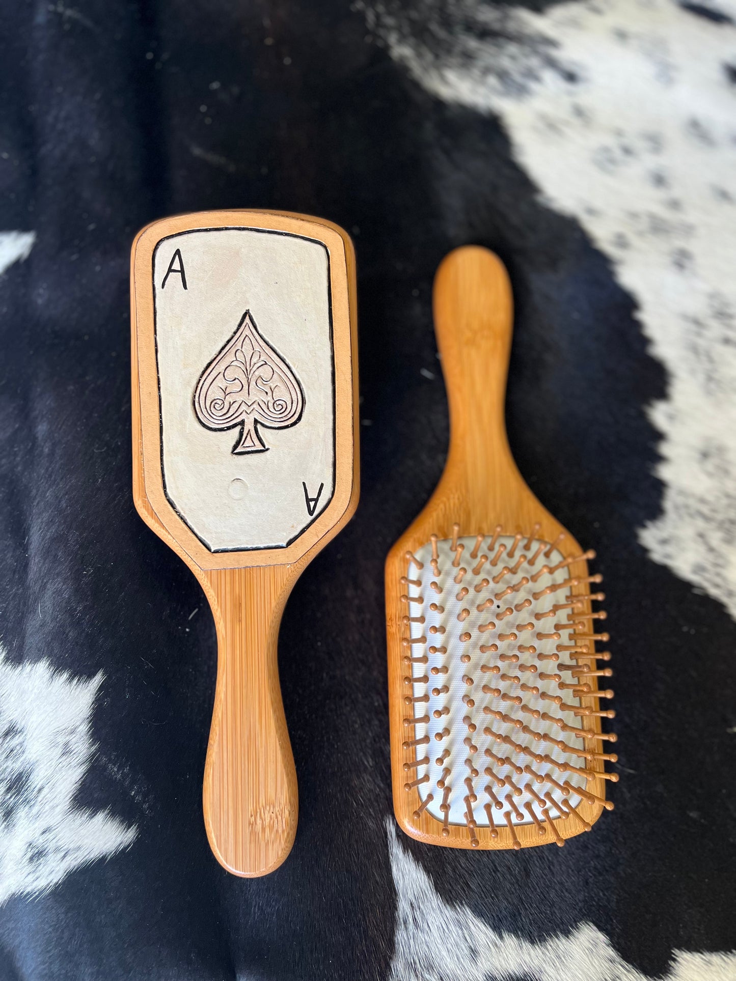 Hand tooled and cowhide hairbrush