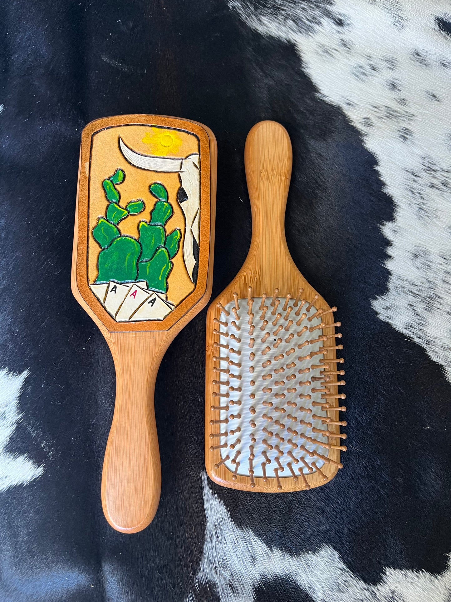 Hand tooled and cowhide hairbrush