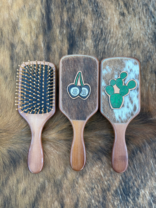 Hand tooled and cowhide hairbrush