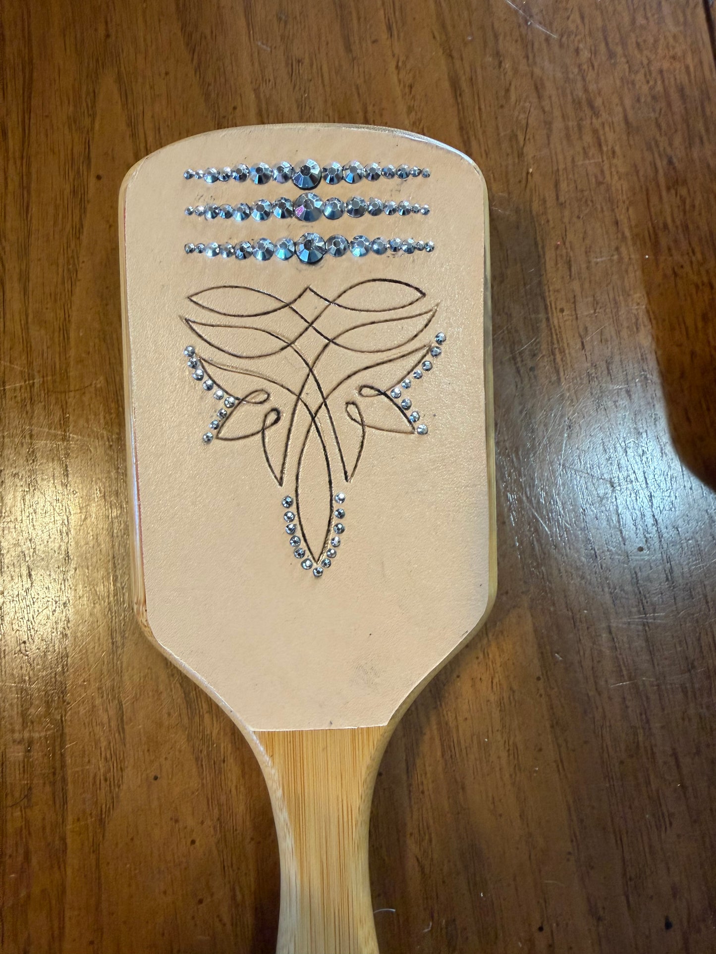 Hand tooled and cowhide hairbrush