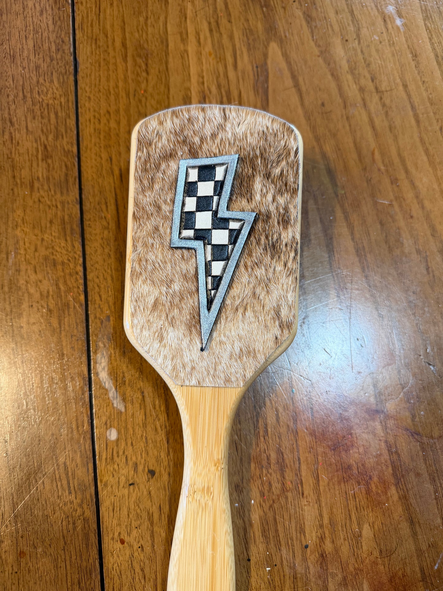 Hand tooled and cowhide hairbrush