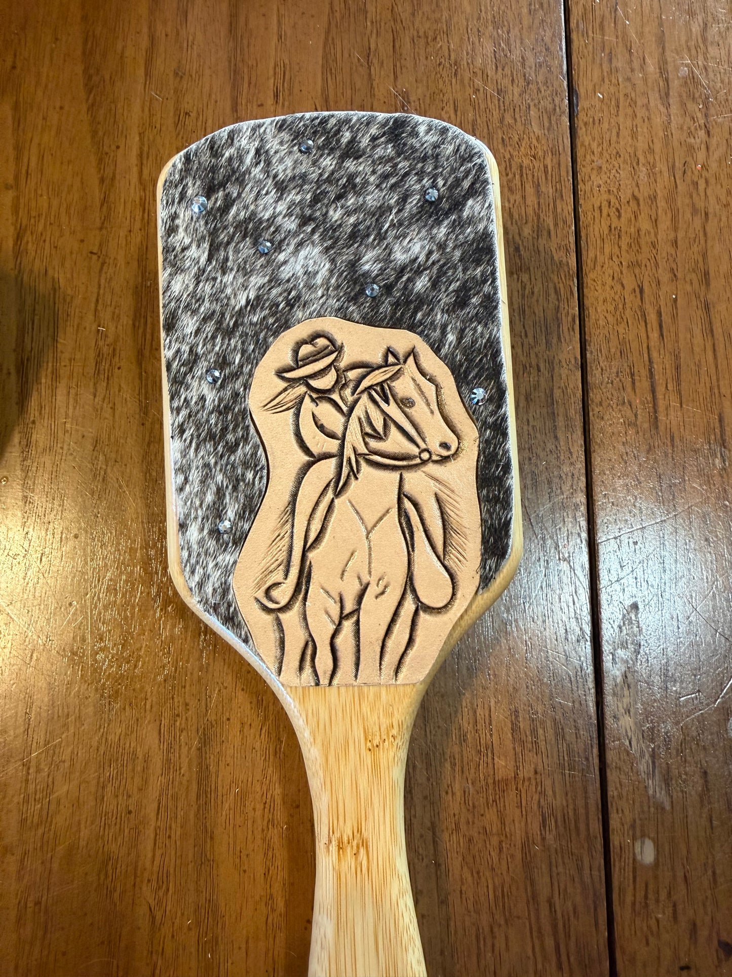Hand tooled and cowhide hairbrush