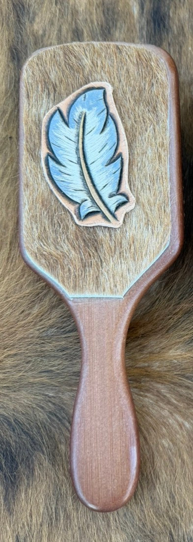 Hand tooled and cowhide hairbrush
