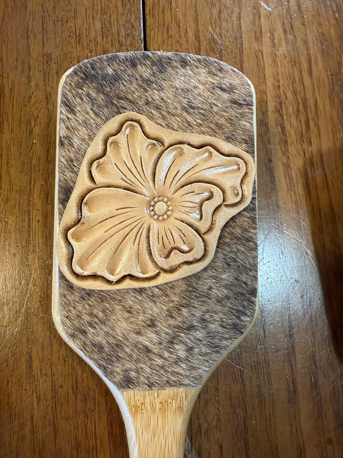 Hand tooled and cowhide hairbrush