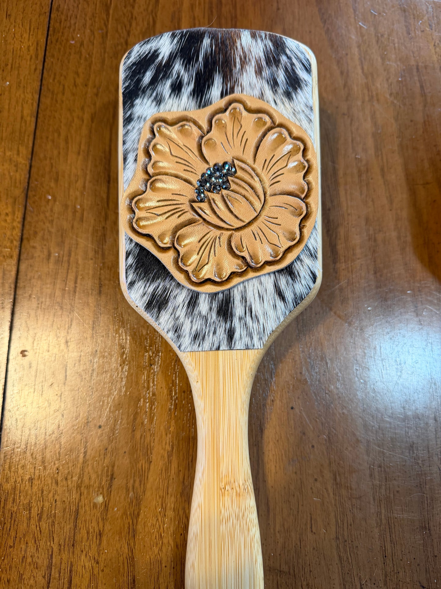 Hand tooled and cowhide hairbrush