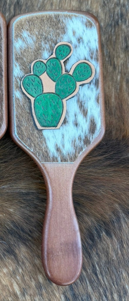 Hand tooled and cowhide hairbrush
