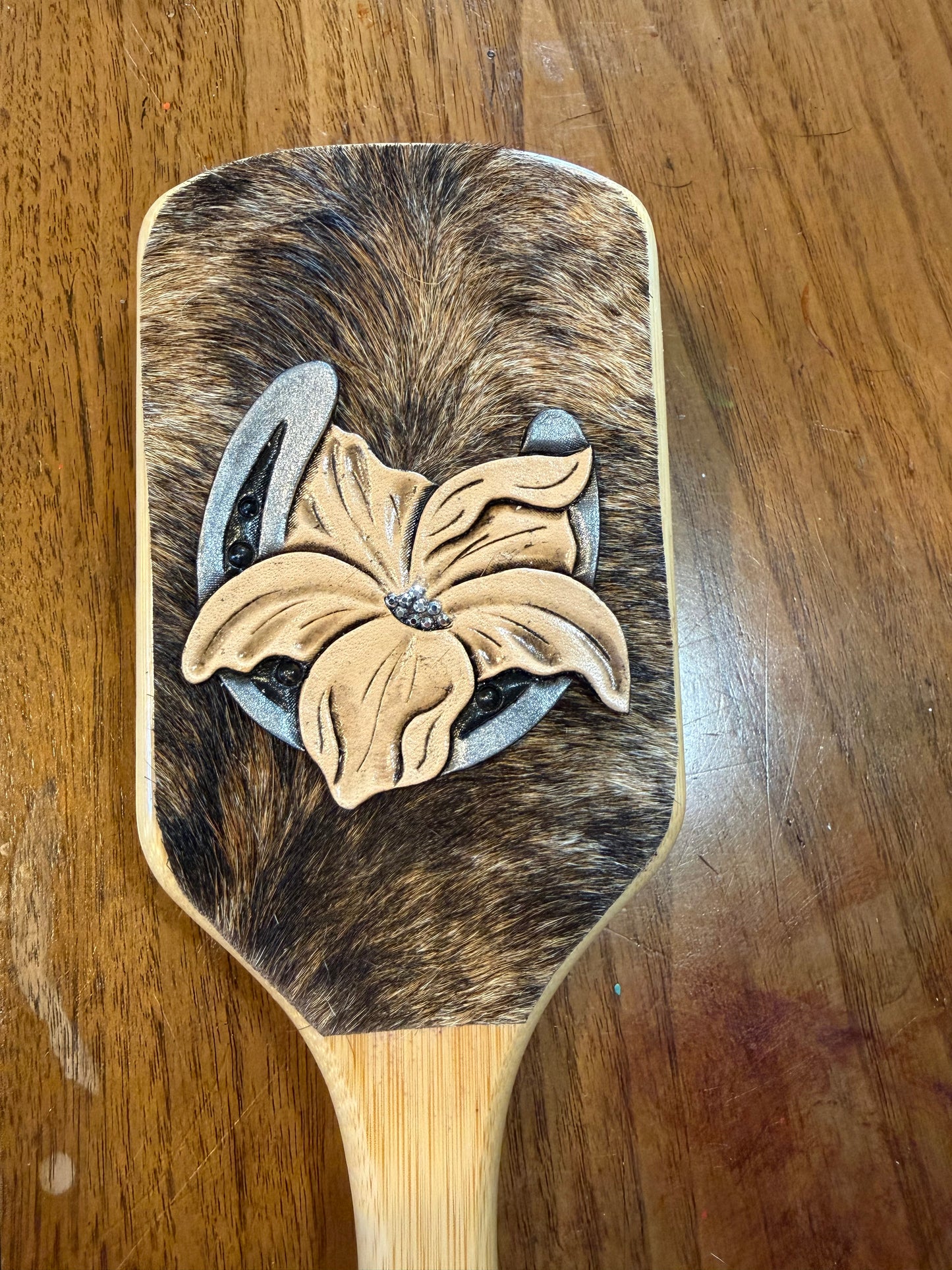 Hand tooled and cowhide hairbrush